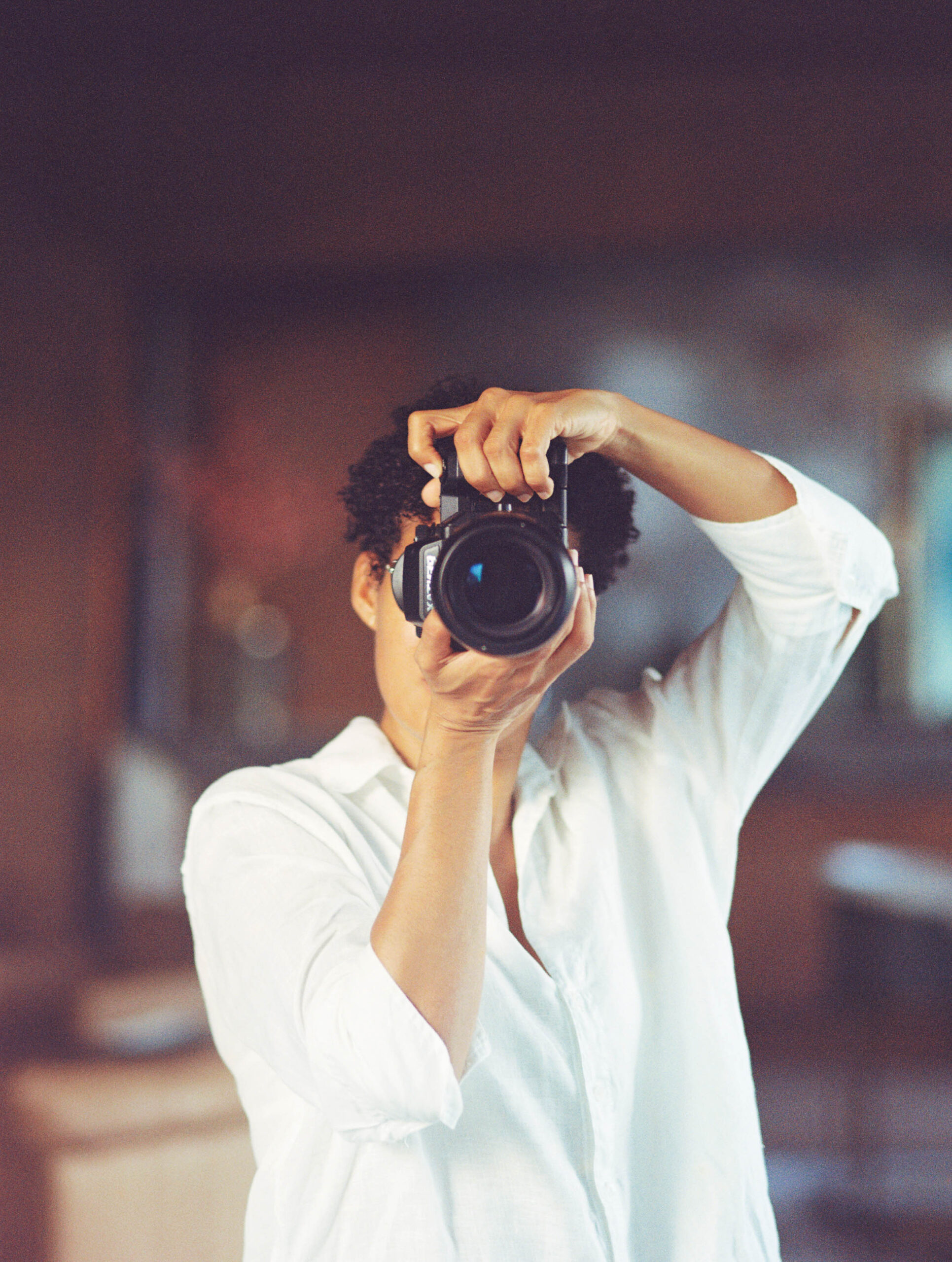Asia Pimentel holding her camera up to her face