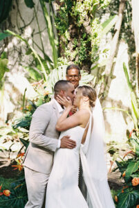 Sam and Tito sharing their first kiss as husband and wife in the garden, Casa Colonial, Dominican Republic