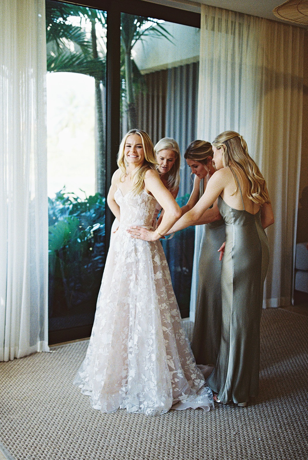 Bride getting dressed with bridesmaids, Lauren & August's Casa de Campo wedding, Dominican Republic