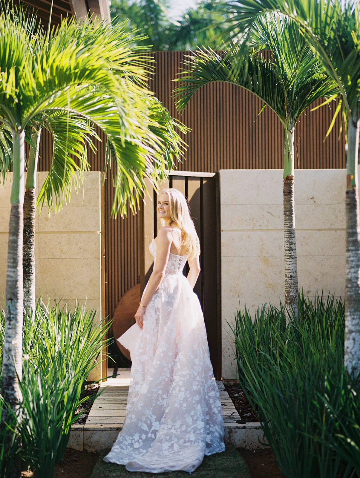 Bride walking through tropical garden, Lauren & August's Casa de Campo wedding, Dominican Republic