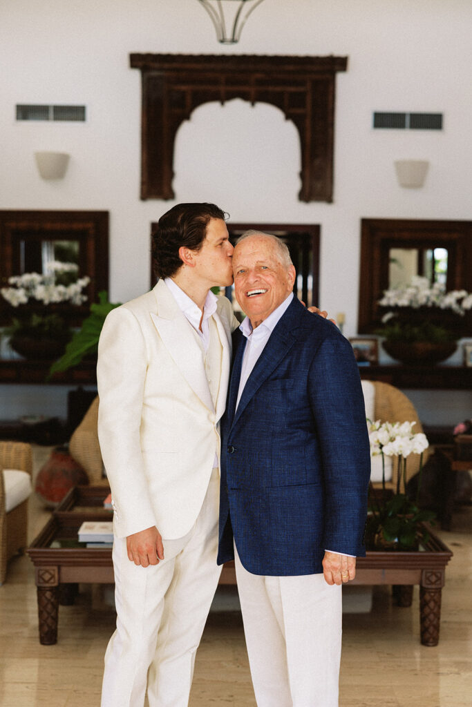 Groom and father share intimate portrait moment at Casa de Campo wedding