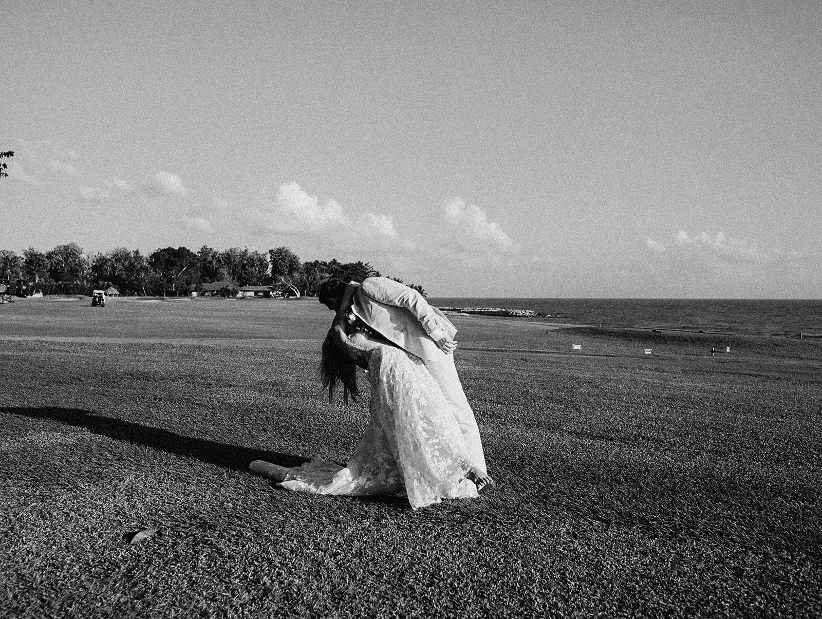 Newlywed kiss oceanfront black and white, Lauren & August's Casa de Campo wedding, Dominican Republic