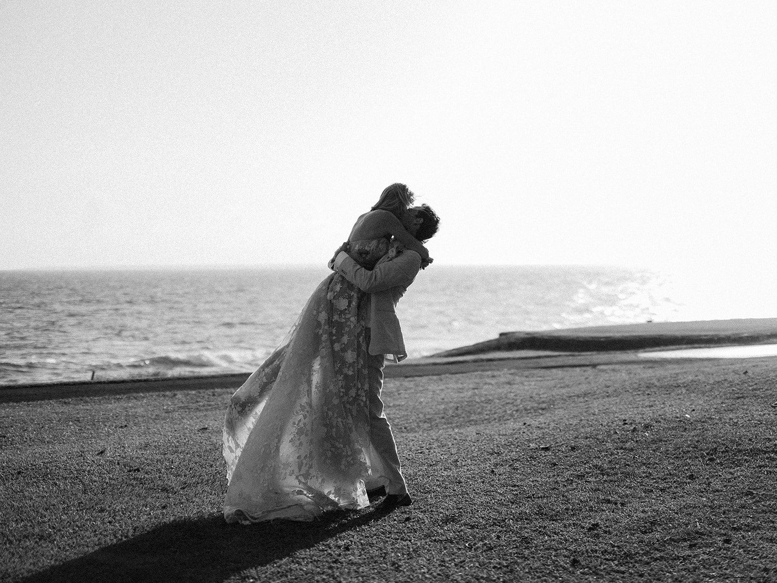 Newlyweds embrace oceanfront black and white, Lauren & August's Casa de Campo wedding, Dominican Republic