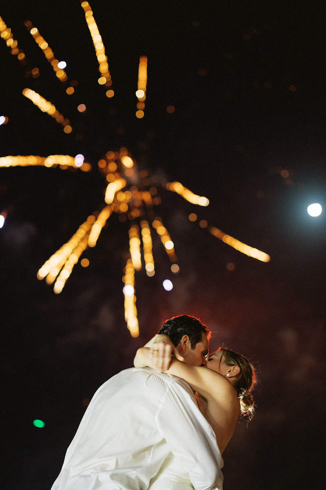 Newlyweds kissing fireworks, Lauren & August's Casa de Campo wedding, Dominican Republic