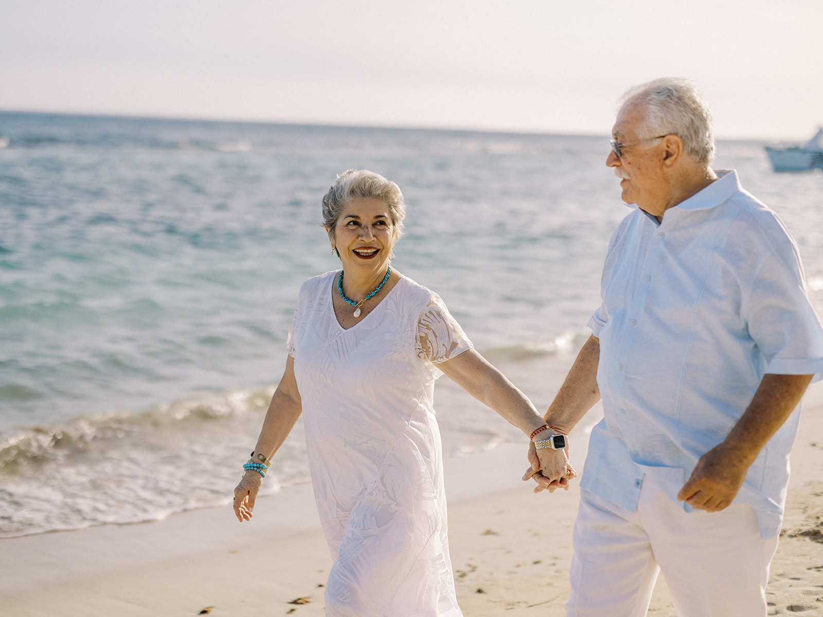 Elder couple walking hand in hand during family portrait session at Casa de Campo Resort