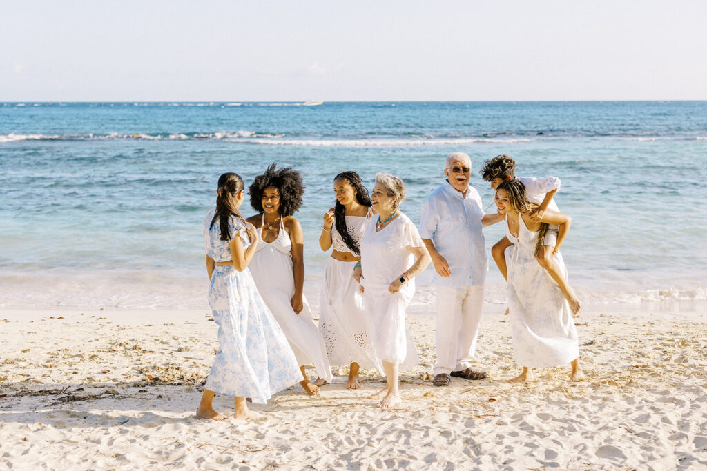 Grandparents and grandchildren playful beach moment during family portrait at Casa de Campo, Dominican Republic