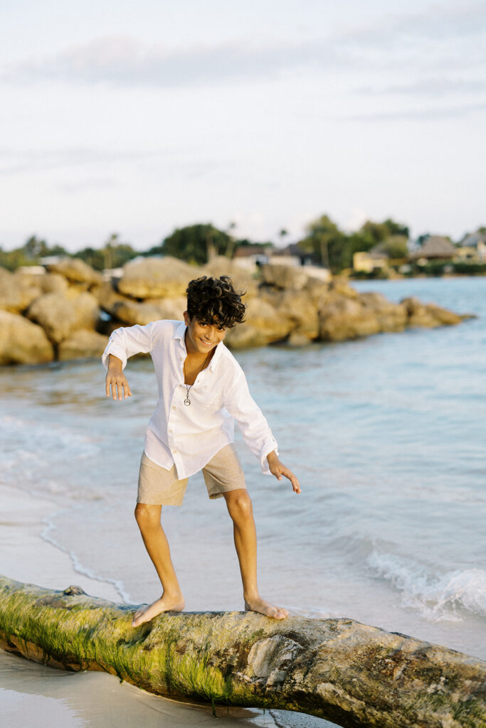 Young boy playful moment during family portrait at Casa de Campo, Dominican Republic