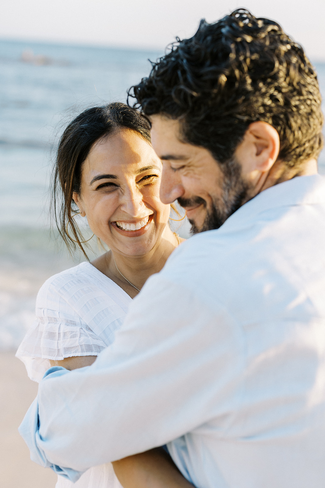 Couple playful moment together during family portrait at Casa de Campo Resort