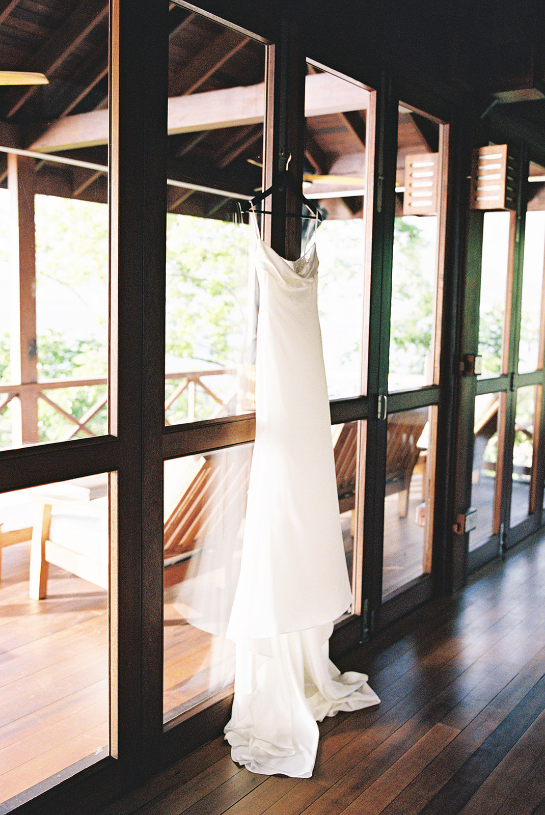 Elizabeth's wedding dress hanging in the villa doorway