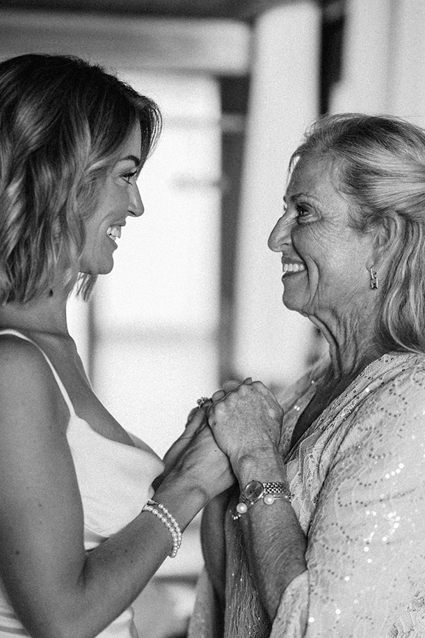 Elizabeth and her mother, foreheads together, laughing