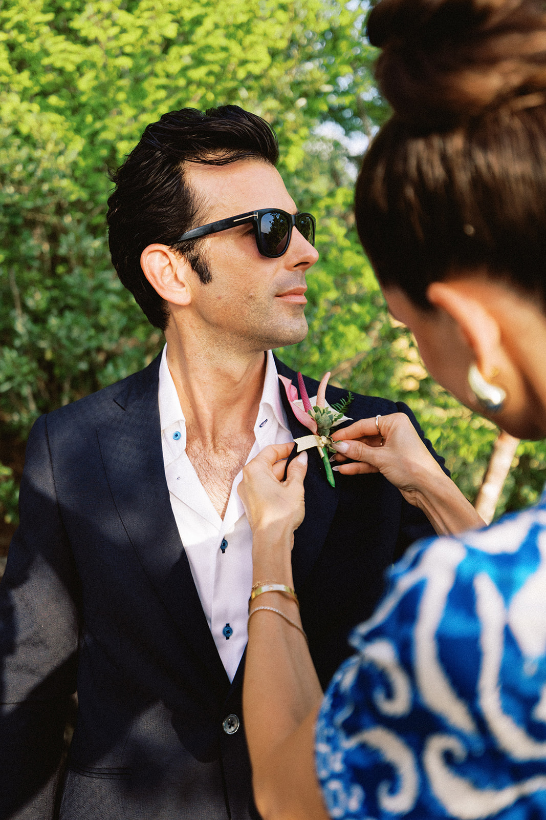 Aaron having his boutonniere pinned