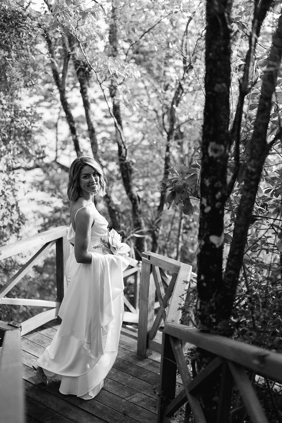 Elizabeth walking down the wooden steps, black and white