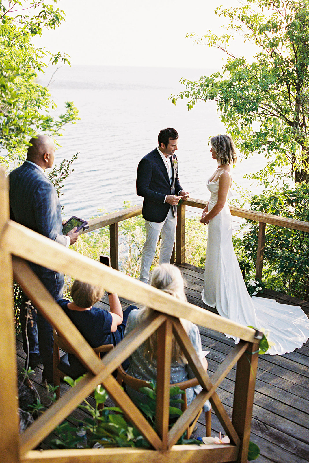 Elizabeth and Aaron approaching the ceremony with their four guests seated