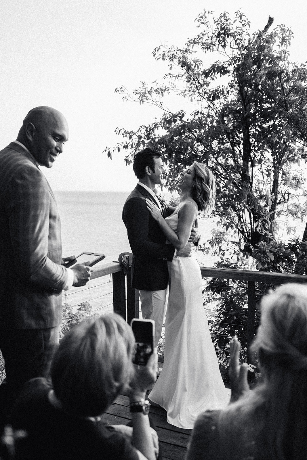 The officiant with Elizabeth and Aaron just after the ceremony, black and white