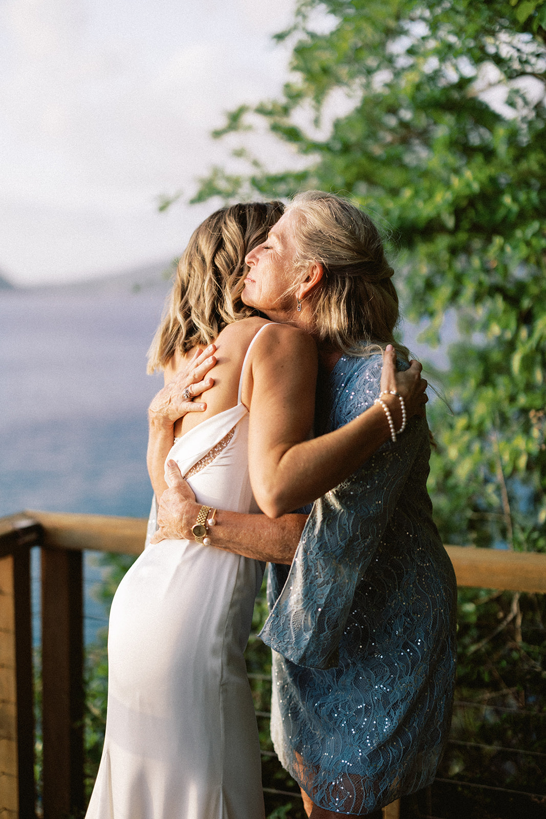 Elizabeth's mother embracing her closely