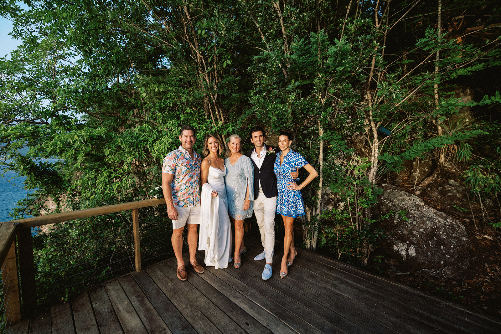 Elizabeth, Aaron, and their four guests together on the cliffside deck