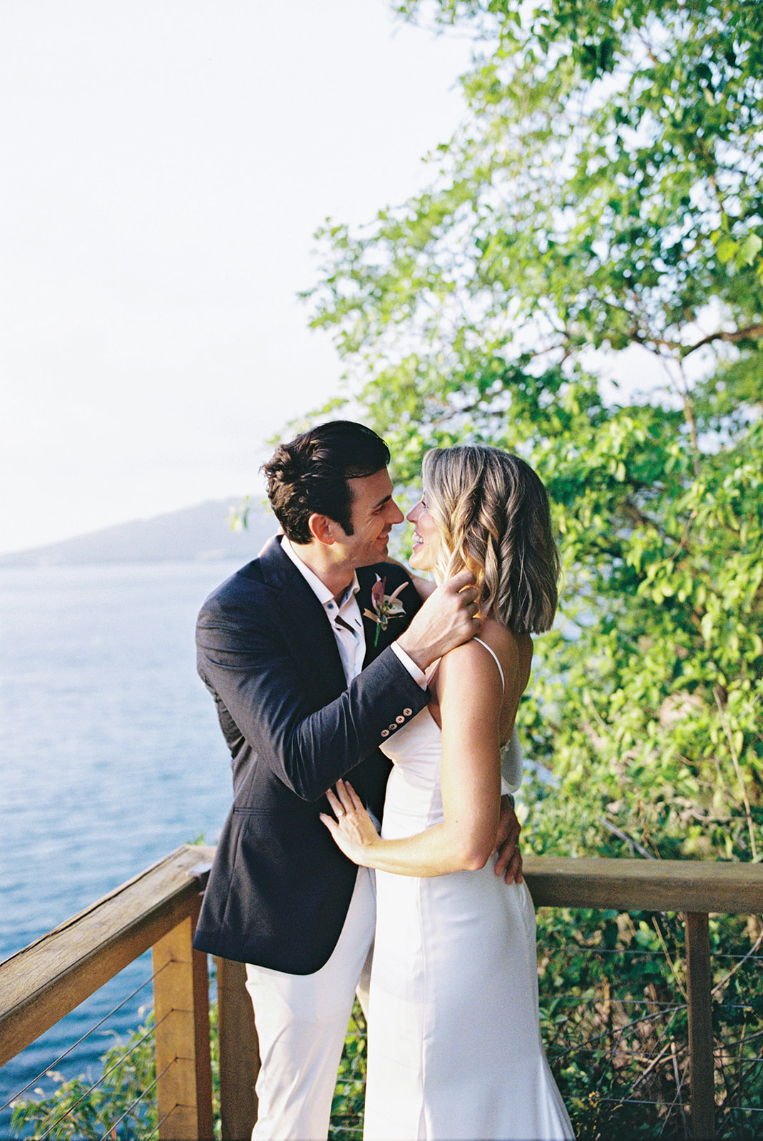 Elizabeth and Aaron in a close embrace on the cliffside